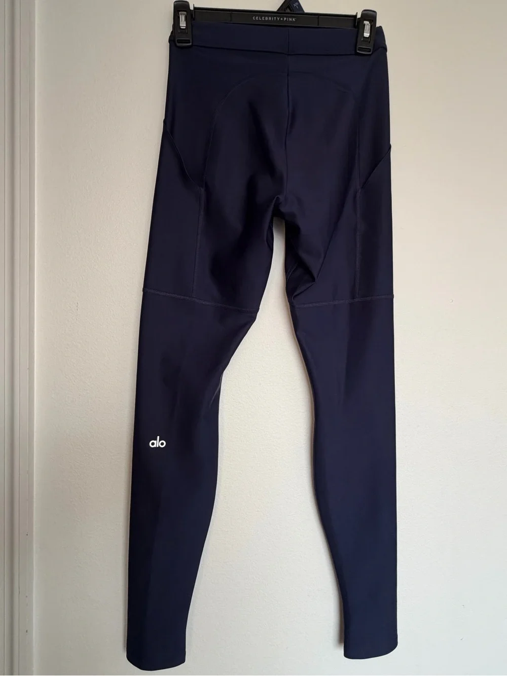 Alo Yoga High-Waist Airlift 4 Pocket Utility Leggings in a dark navy blue color.